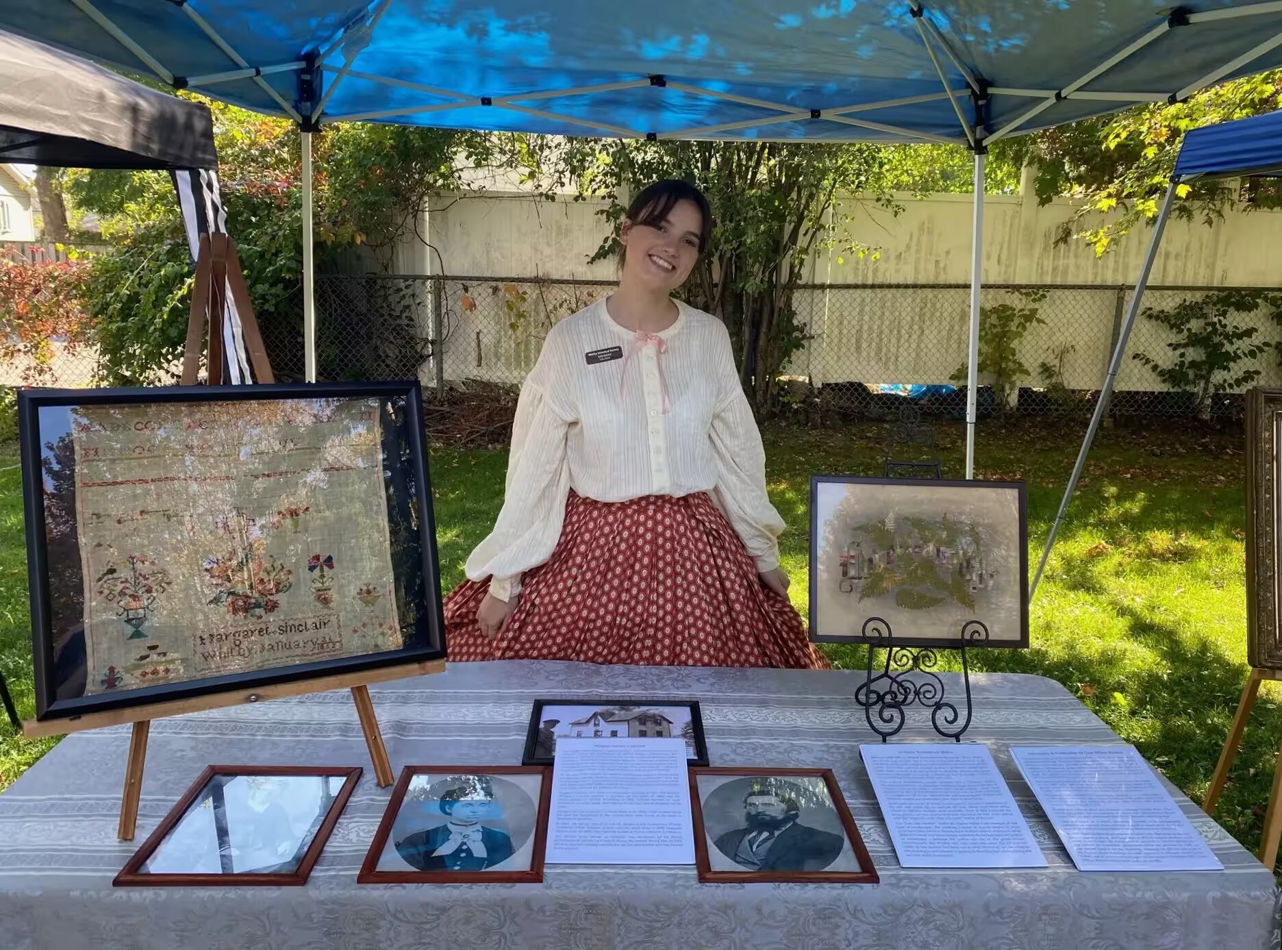 Picture of Erin working the needlework booth at the Lynde House Museum's Annual History In The Park.